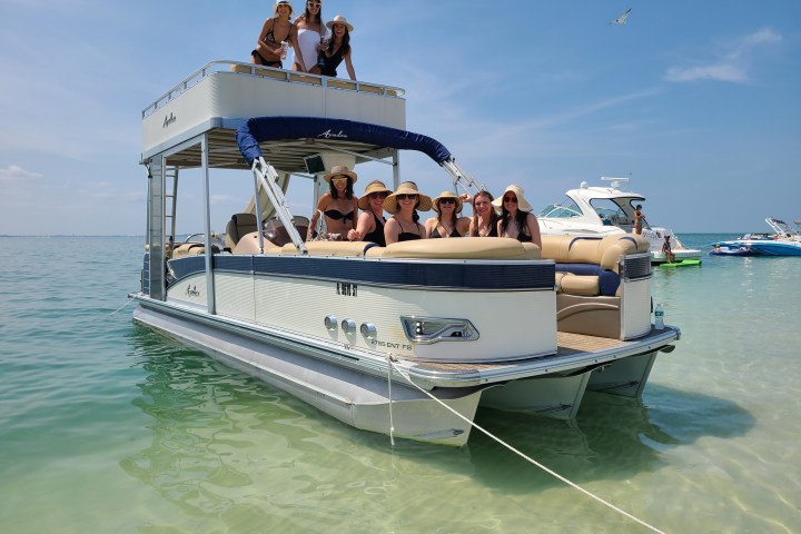 a group of people on a boat in the water